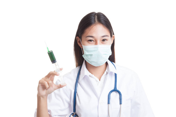Young Asian female doctor with mask hold syringe. - Valokuva, kuva