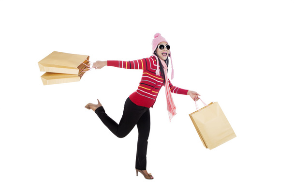 Woman running with shopping bags - Valokuva, kuva