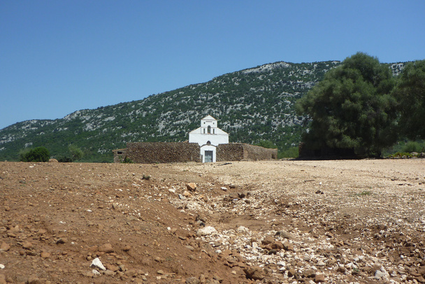 San Pietro church on Golgo upland with zoom on the street - Photo, Image