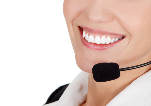 Cheerful call center operator against white background - Фото, изображение