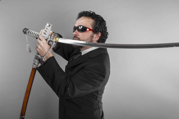 aggressive lawyer with Japanese sword - Foto, imagen