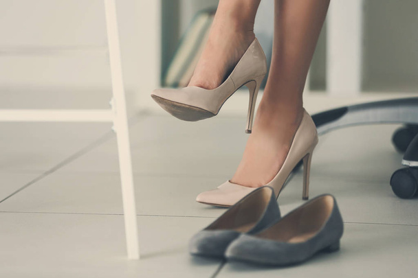 Woman changing shoes - 写真・画像