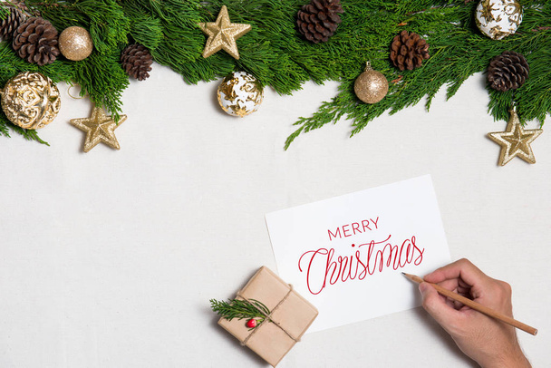 Christmas gift and hand writing greeting - Foto, Imagem
