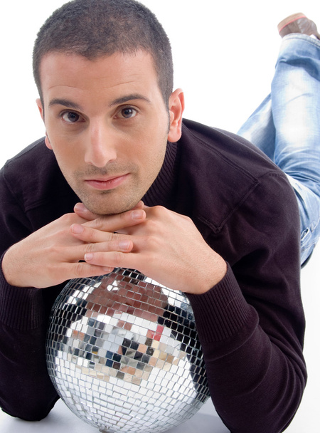Young guy resting on shiny disco ball - Foto, immagini