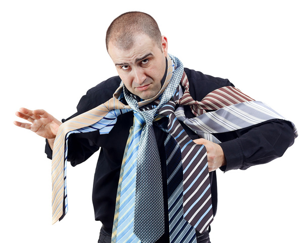 Hombre enojado eligiendo la corbata perfecta
 - Foto, Imagen