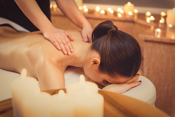 Relaxed girl getting massage at spa - 写真・画像