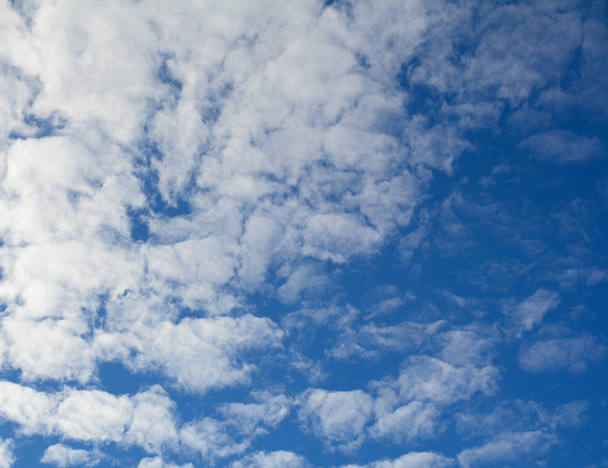 White fluffy clouds at sunny day in the blue sky - Photo, Image