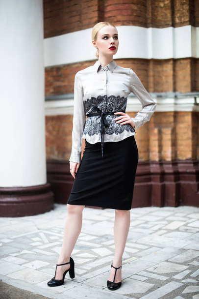 Pretty young business woman wearing formal clothes - Фото, изображение