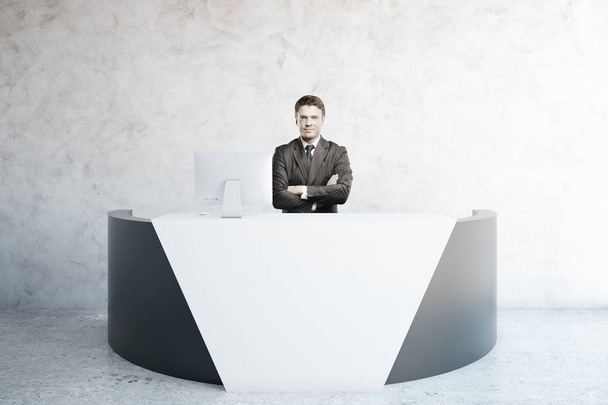 Businessman at reception desk - Fotó, kép
