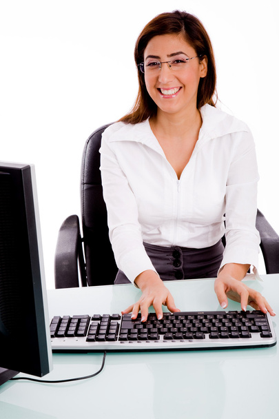 Female working on computer - Foto, afbeelding