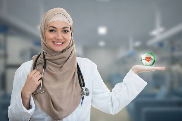 smiling confident Muslim female doctor  - 写真・画像