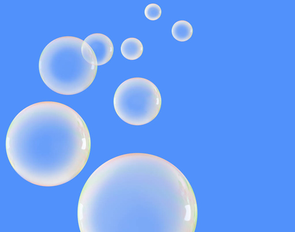 Burbujas de jabón sobre un cielo azul
 - Foto, imagen