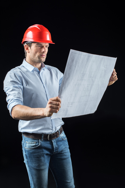 Male engineer with blueprint - Photo, Image