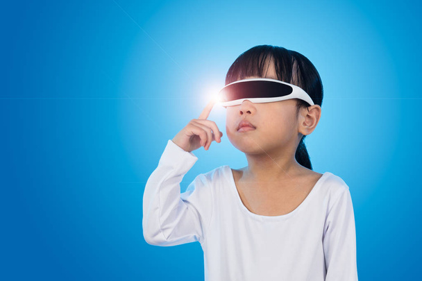 Asian Chinese little girl with futuristic eyeglassses in isolate - Photo, Image