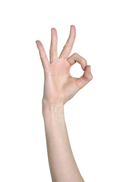 Primer plano de la mano muestra un gesto ok se aísla en un fondo blanco
 - Foto, imagen