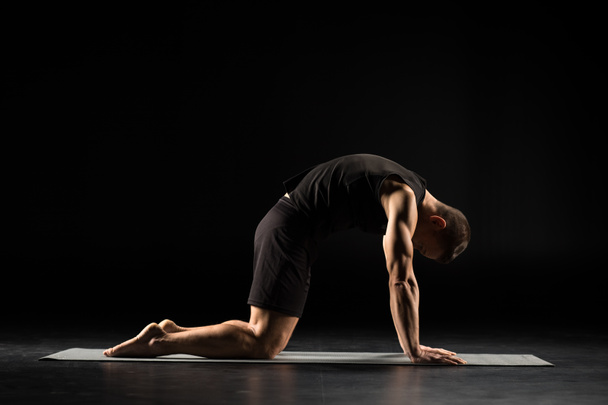 Man standing in yoga position - Photo, Image