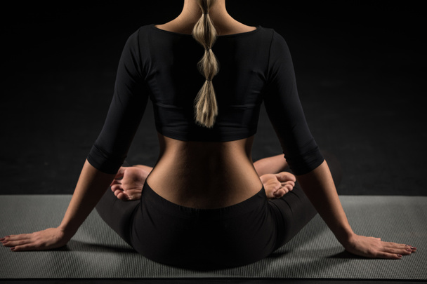 Woman sitting in lotus position - Photo, image