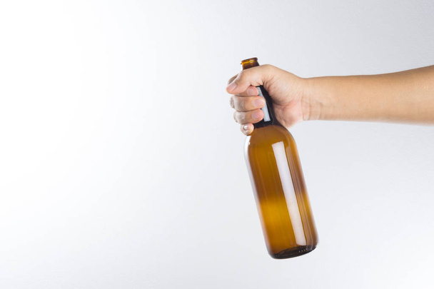 Hand holding a beer bottle - Φωτογραφία, εικόνα