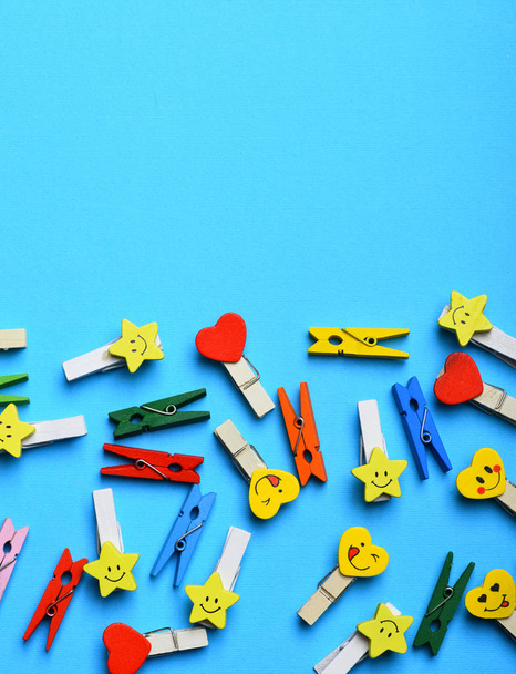 colorful clothespins on blue - 写真・画像