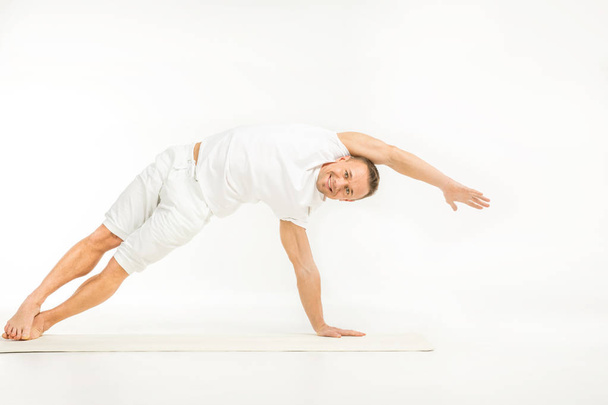 Man practicing yoga - Photo, Image