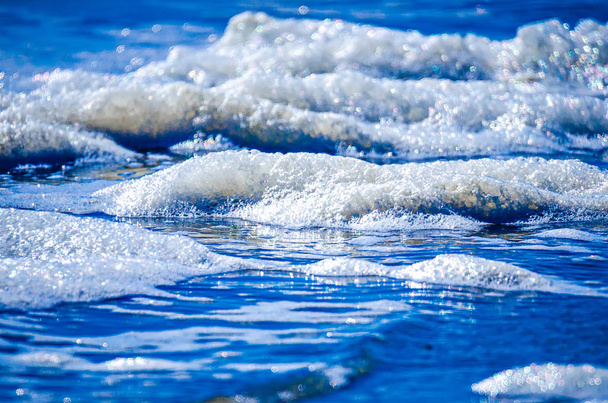 Close up view of beautiful blue ocean wave with white foam - Photo, Image