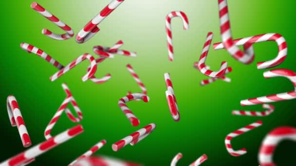 Boże Narodzenie candy na zielonym tle - Materiał filmowy, wideo