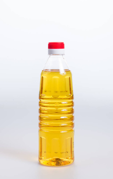 oil or oil in plastic bottle on the background. - Photo, image
