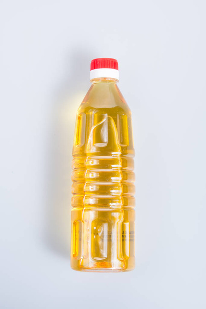 oil or oil in plastic bottle on the background. - Foto, Bild