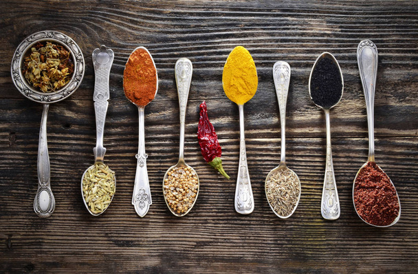 Assortment of spices in vintage spoons - Photo, Image