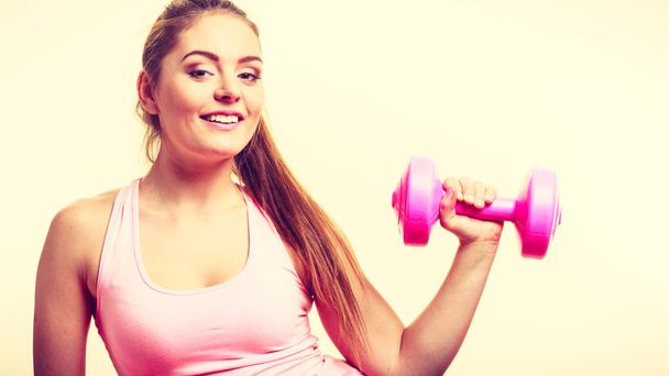 Sporty girl lifting weights.  - Fotografie, Obrázek