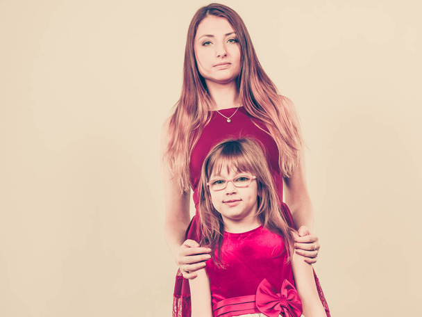 Mother and daughter posing together - Foto, imagen
