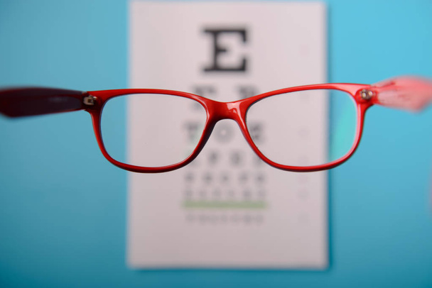 glasses lying on snellen test chart - Photo, Image