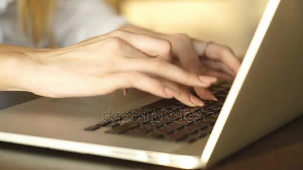 Closeup of a female hands busy typing on a laptop - Video, Çekim