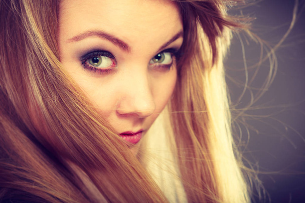 Attractive blonde woman with windblown hair - Фото, зображення