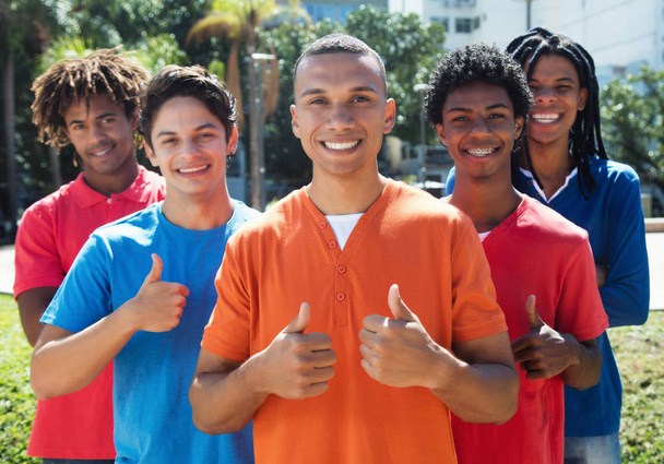 Group of five young men showing thumbs up - Foto, immagini