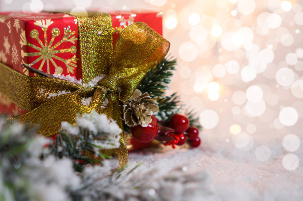 Christmas background with presents gold ribbon and christmas lights - 写真・画像
