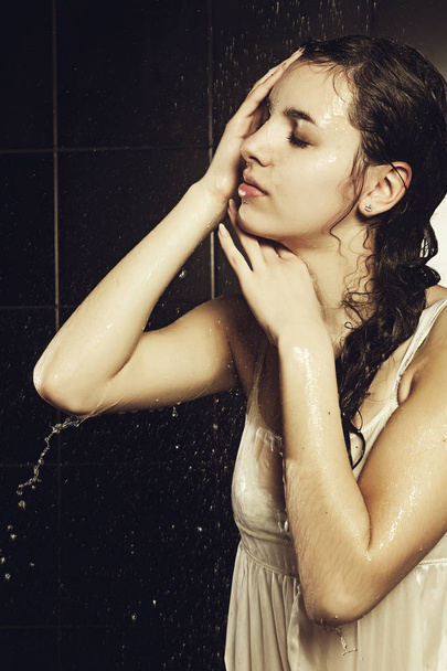 young curly woman with water - Photo, image