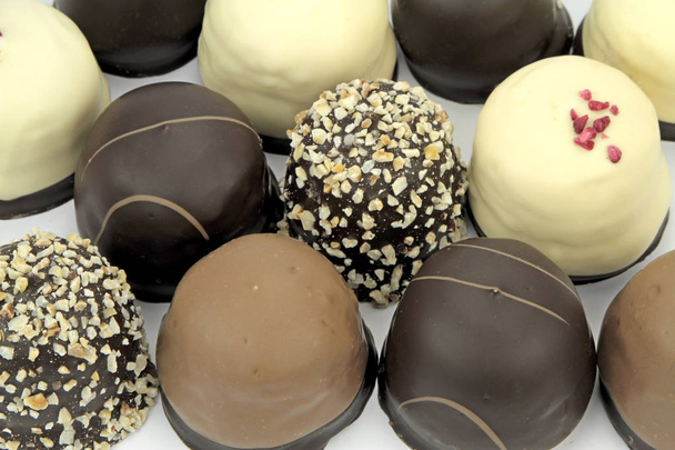 Chocolate coated cream puffs - Фото, изображение