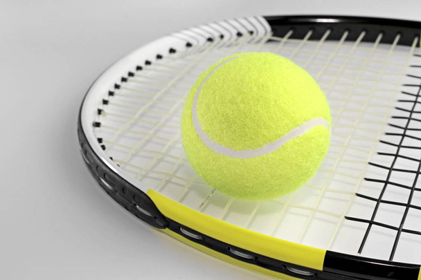 Tennis ball on a racket - Foto, immagini