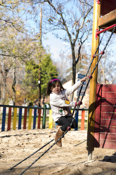 Playing on the park slide - Фото, изображение