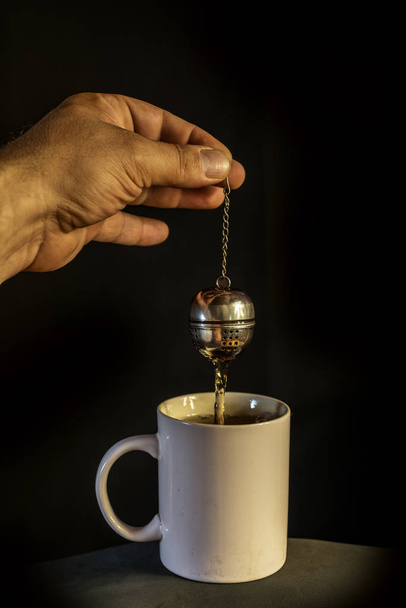 man's hand preparing tea - Photo, image