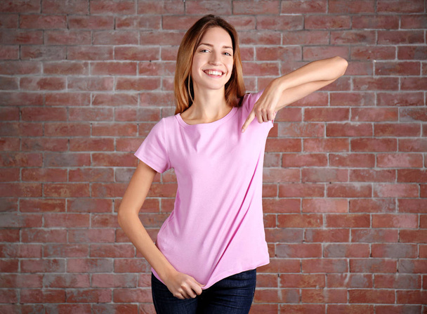 Young woman in blank t-shirt - Фото, зображення