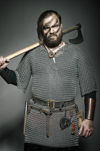 Viking with his axe on the grey background - Fotoğraf, Görsel