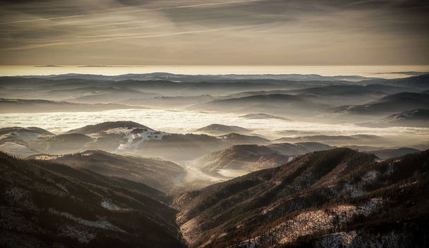 Mountain panorama - inversion and colorful sky - Photo, Image