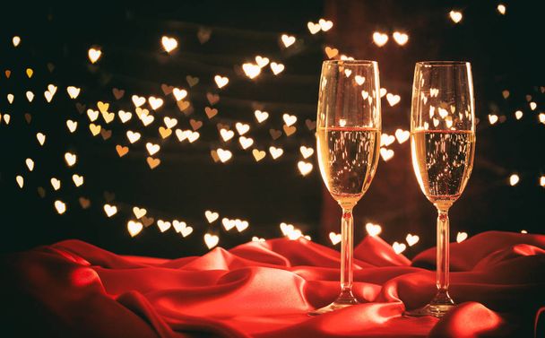 Champagne glasses on hearts bokeh background - Photo, image