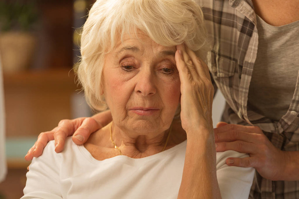 Senior woman feeling discomfort - Фото, изображение