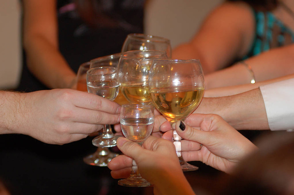 Group of friends hit  clink Champagne glasses to ring  - Foto, afbeelding