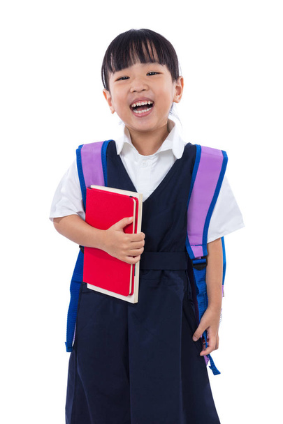 Asiático chino poco escuela primaria chica sosteniendo libros con bolsa
 - Foto, Imagen