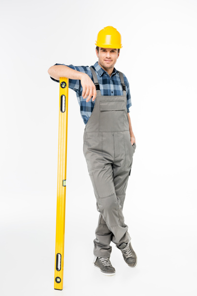 Workman with level tool - Foto, afbeelding