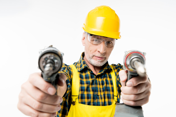 Workman holding electric drills - Photo, Image